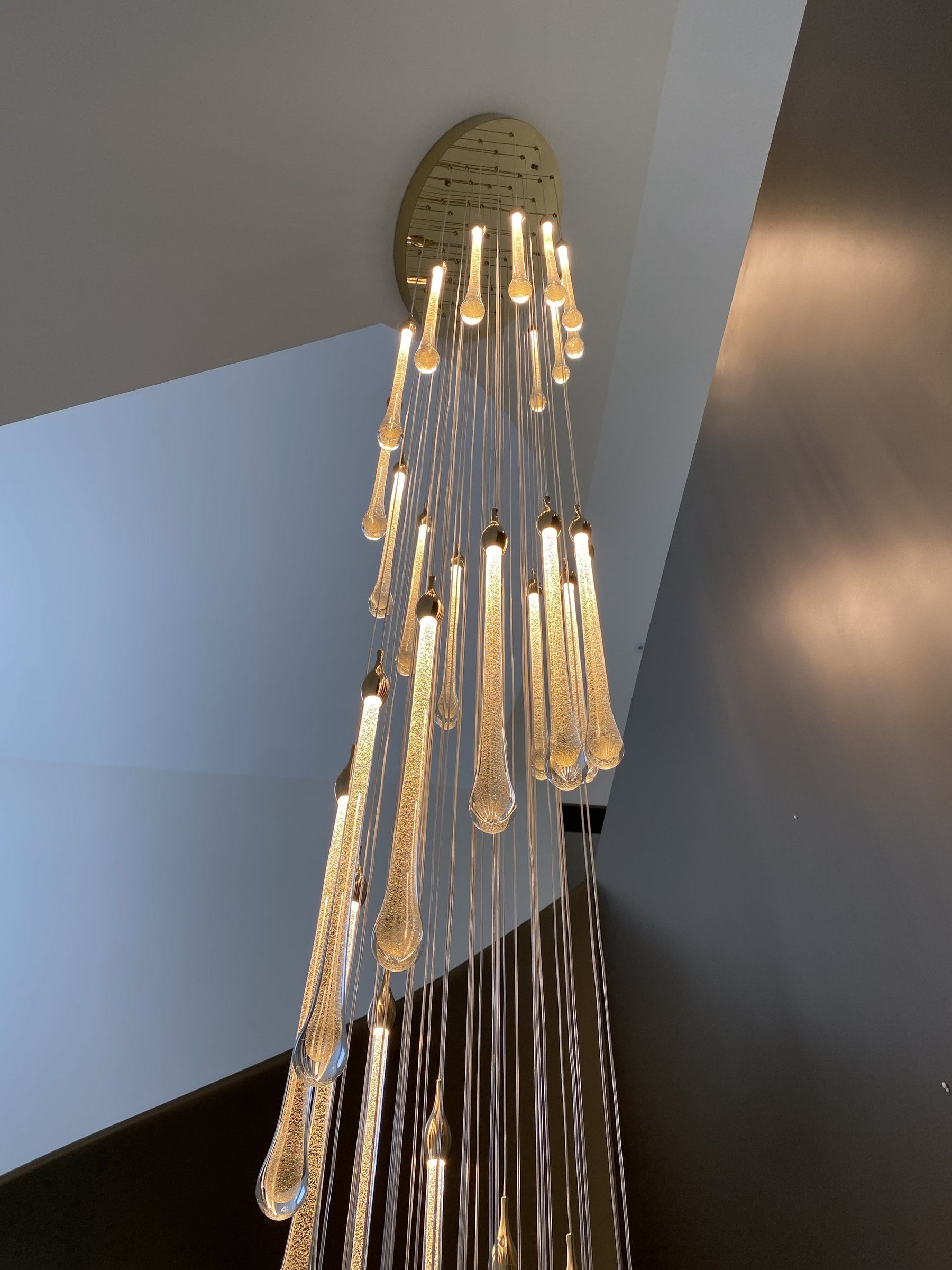 Custom Staircase Chandelier Project: Rain-Like Glass Lighting for a Spiral Staircase