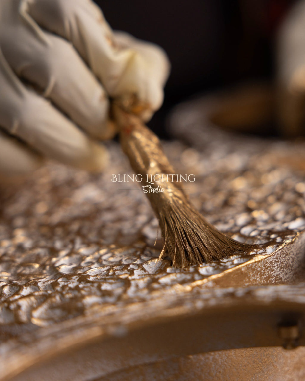 Hand finishing brass and glass detail for Dandelion lighting collection