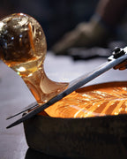 Handcrafted molten glass process detail for Dandelion lighting collection
