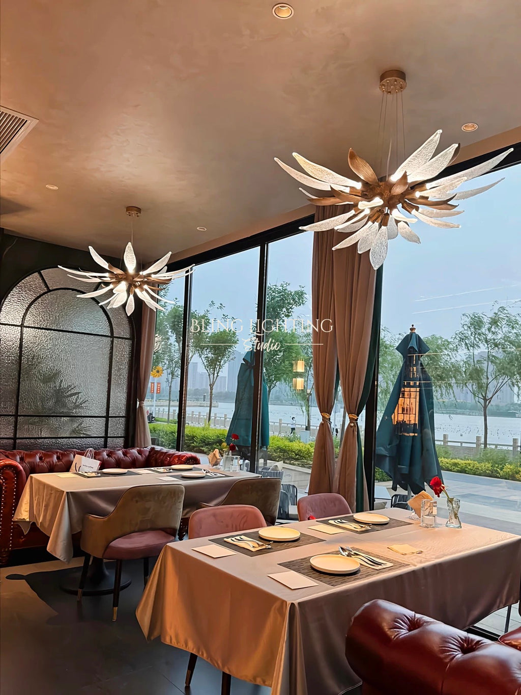 Dandelion linear chandelier installed in a restaurant dining room