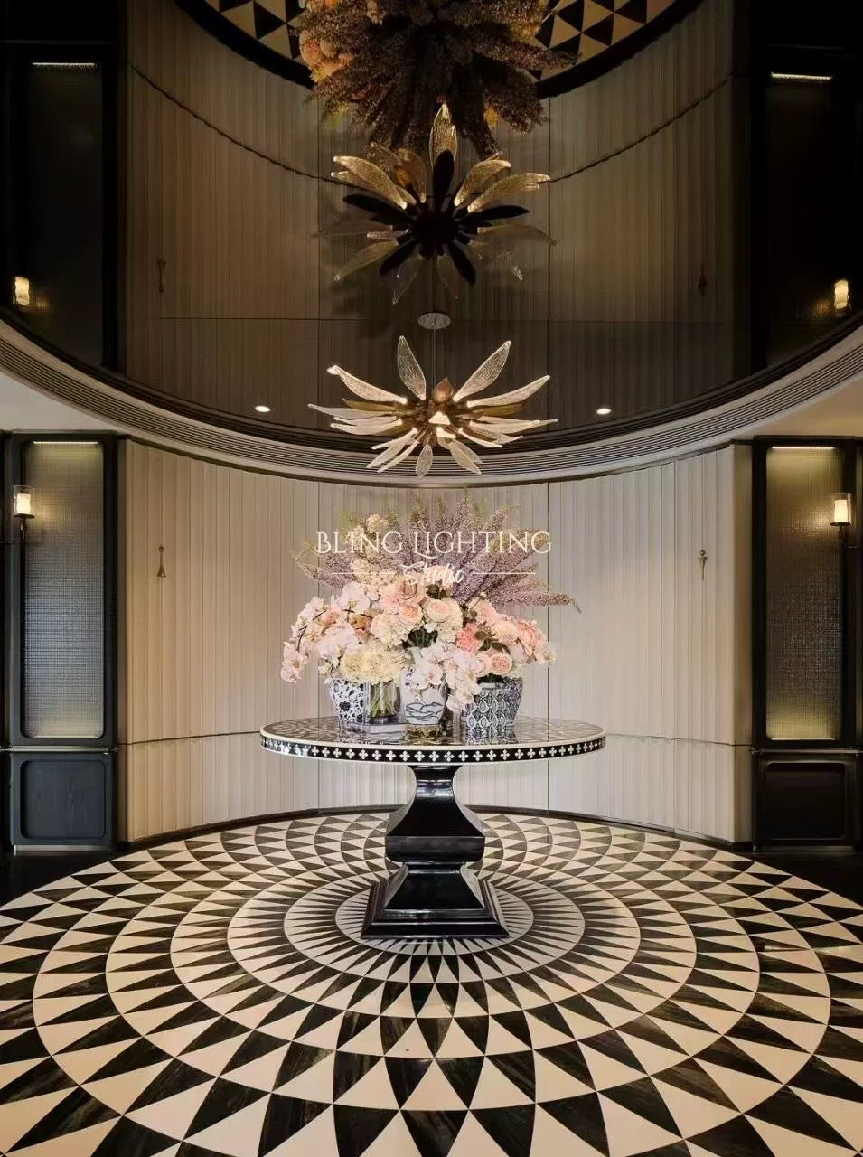 Dandelion multi-tier chandelier over a round floral table in a hotel lobby